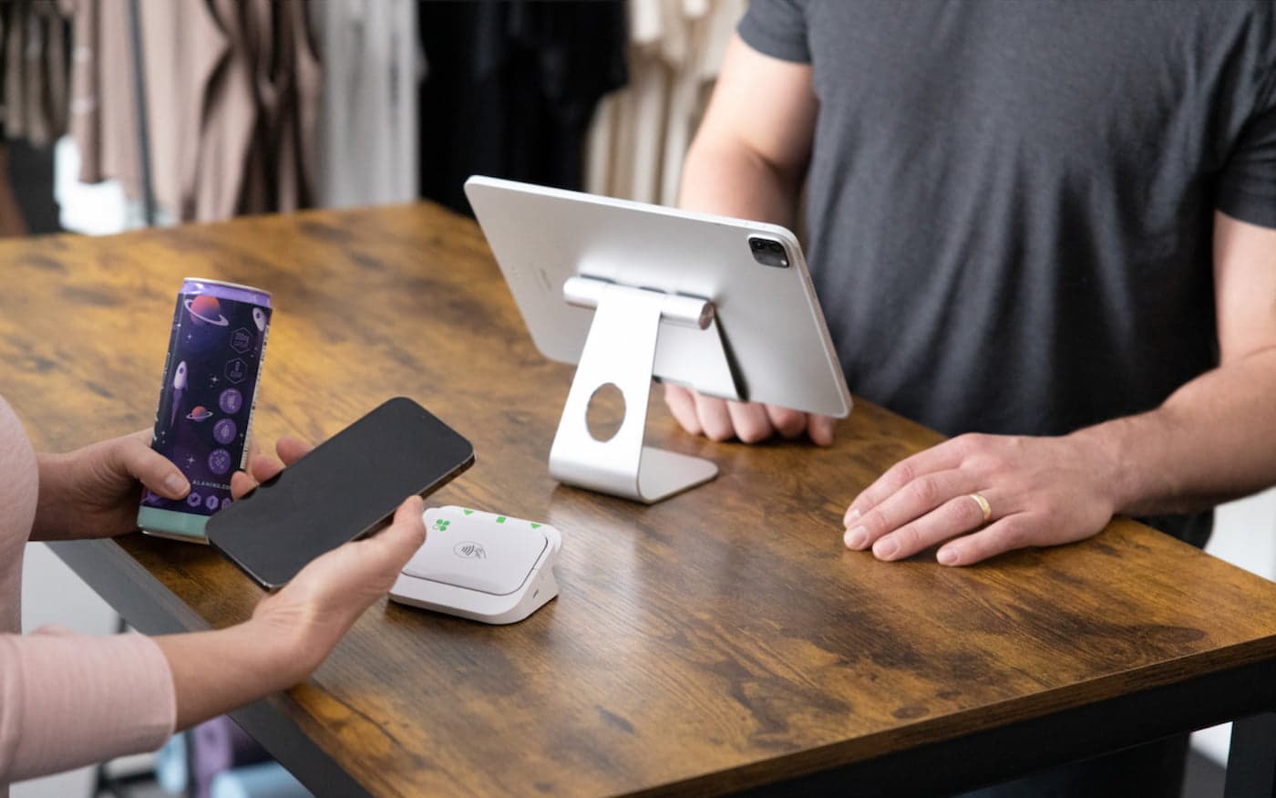 Customer using Clover Go for contactless mobile payment at checkout